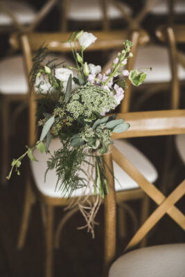 floral on chair down aisle scaled