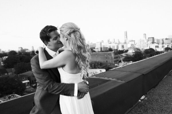 romantic rooftop kiss wedding scaled