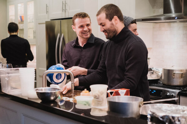 servers in home dinner party scaled