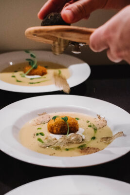 shaved truffles on soup scaled